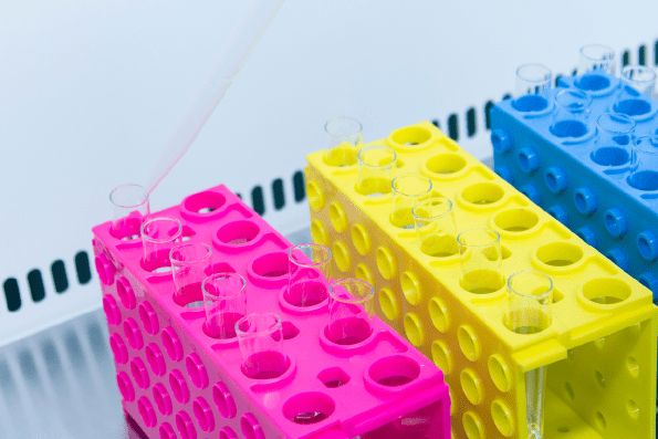 EN 16437 - Arranged test tubes in different colour of test tube holders